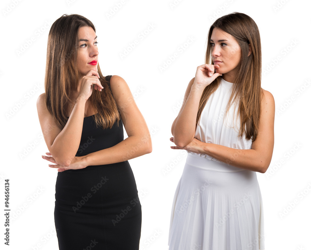 Twin sisters thinking Twin sisters thinking