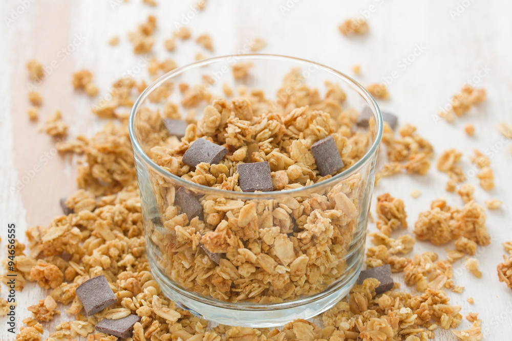 cereals with chocolate in glass on white background cereals with chocolate in glass on white background