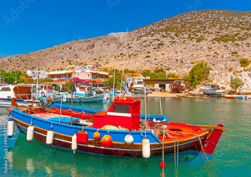 traditional fishing boat docked at the port of Vathi village in Kalymnos island in Greece
