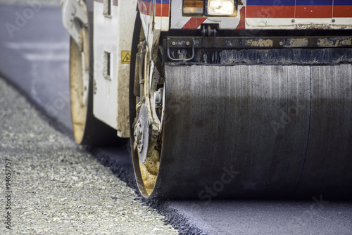 Heavy Vibration roller compactor at asphalt pavement works for road and highway construction photo