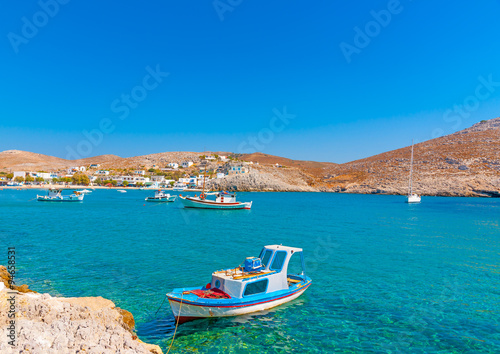 traditional fishing boats docked in the port of Pserimos island in Greece © imagIN photography
