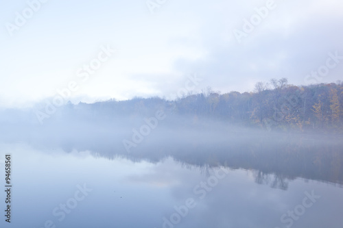 A foggy sunrise on Onota Lake in the Berkshire Mountains of Western Massachusetts.