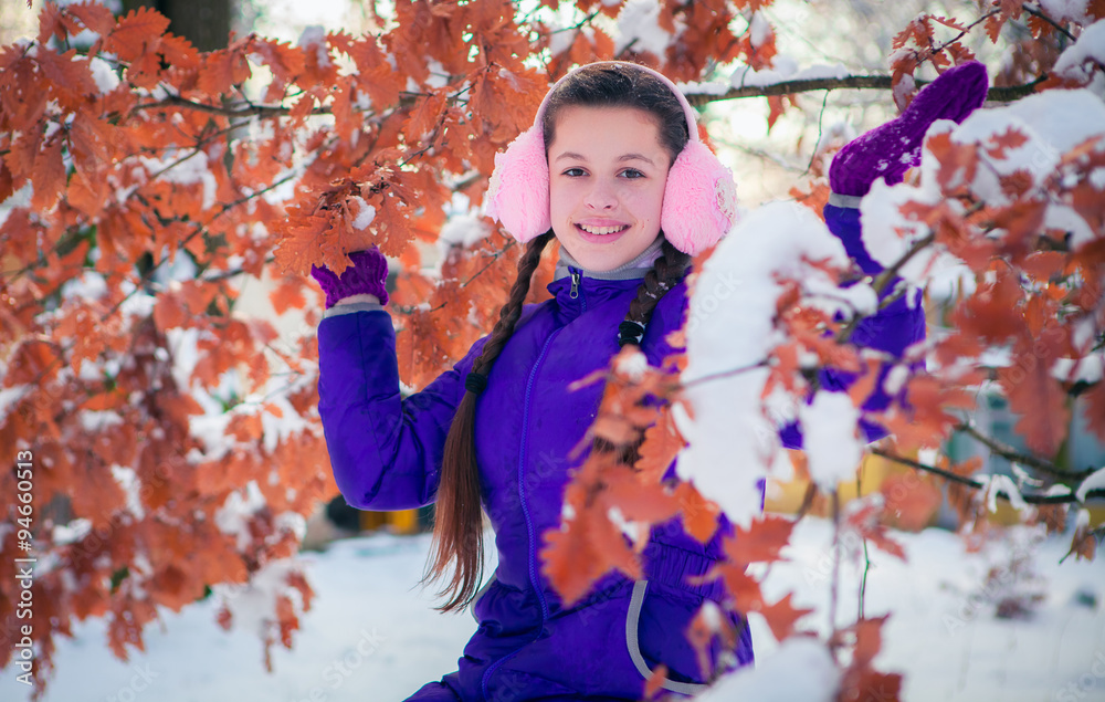 portrait of a young girl in winter park portrait of a young girl in winter park