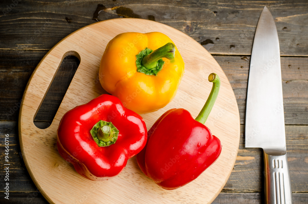 Bell pepper or sweet pepper on wooden plate ready to cooking Bell pepper or sweet pepper on wooden plate ready to cooking