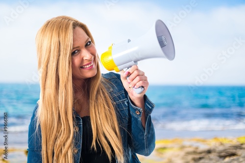 Girl shouting by megaphone