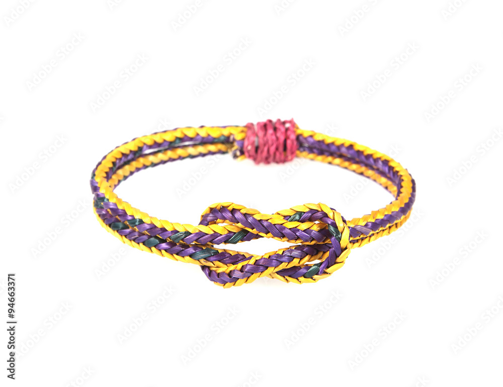 wristband made from woven straw on a white background. wristband made from woven straw on a white background.