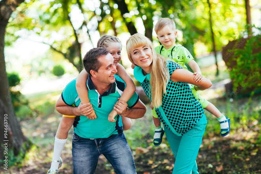 Fototapeta premium Happy family in the park. Happiness.