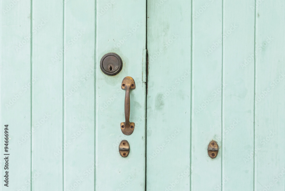 Fototapeta premium Closeup old and pale green wooden door background