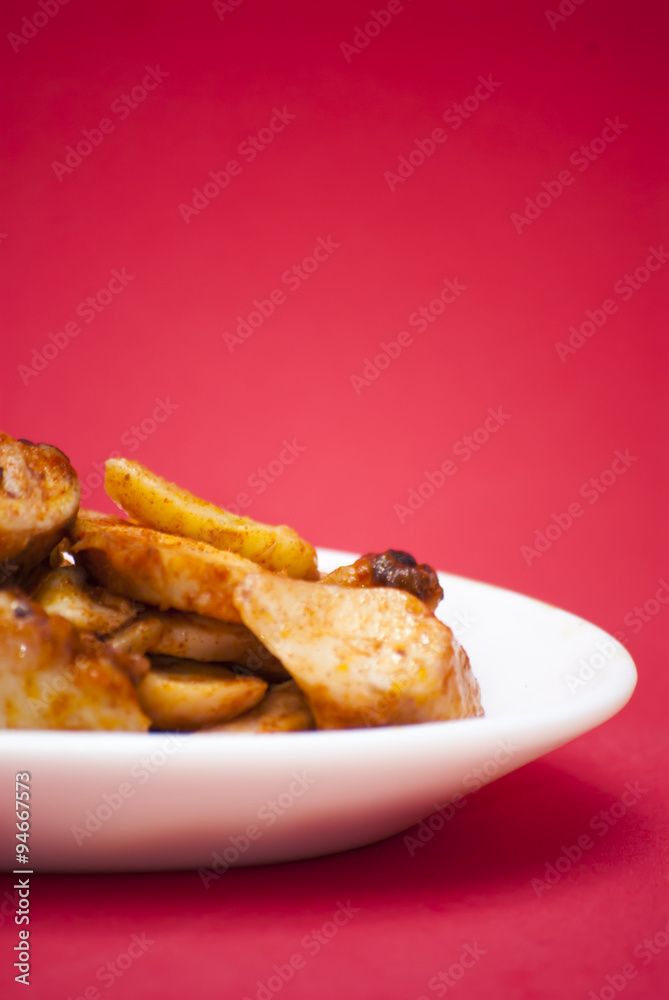 Octopus with paprika on a white plate, also known as Galician oc Octopus with paprika on a white plate, also known as Galician oc