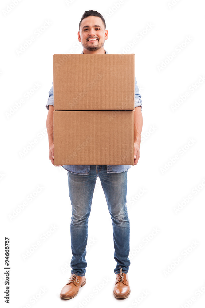 Young man carrying some boxes Young man carrying some boxes