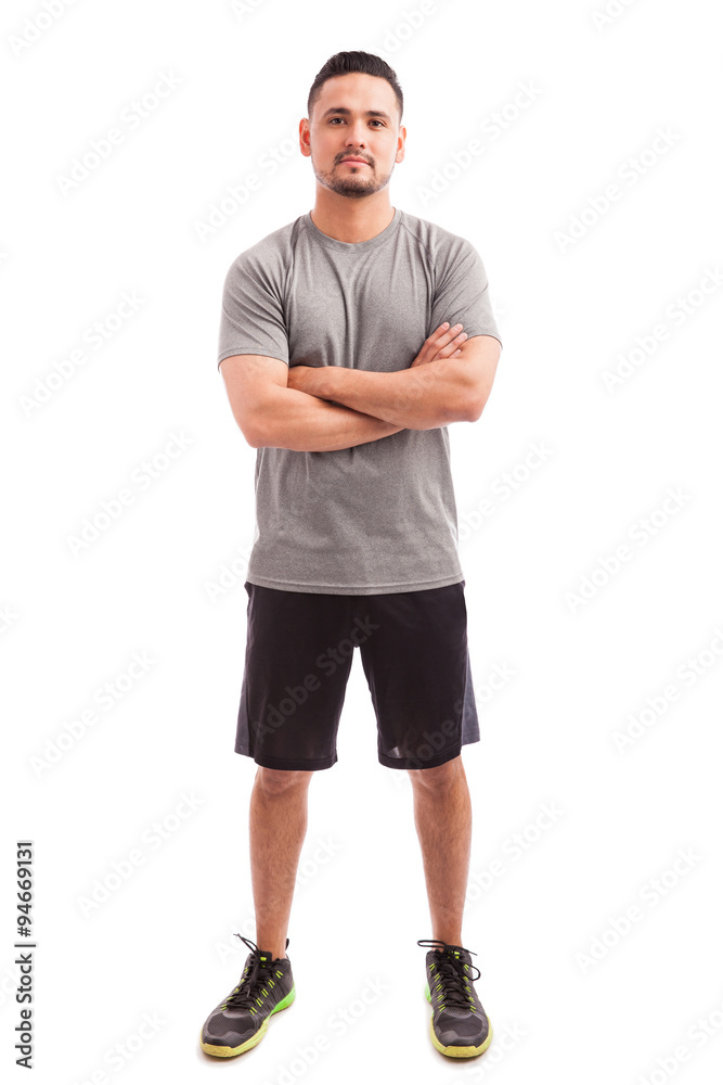 Fototapeta premium Fitness instructor with arms crossed