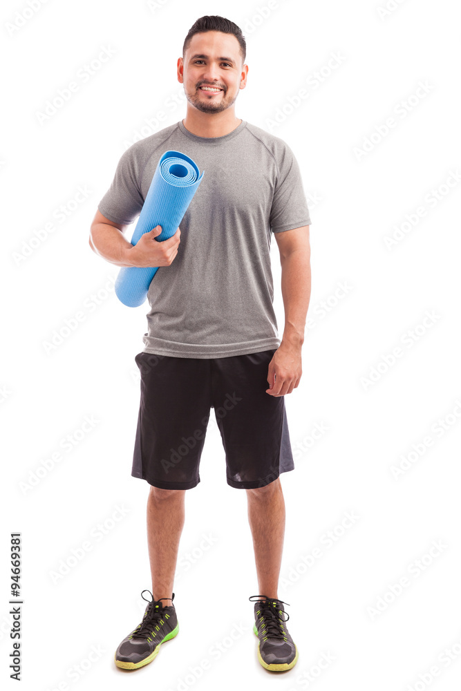 Hispanic man with a yoga mat Hispanic man with a yoga mat