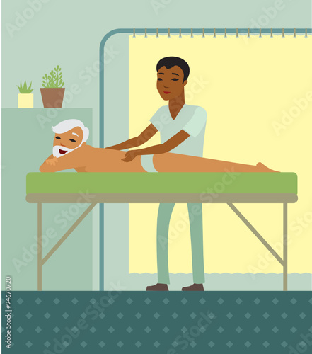 physiotherapist massaging a senior back in the medical centre