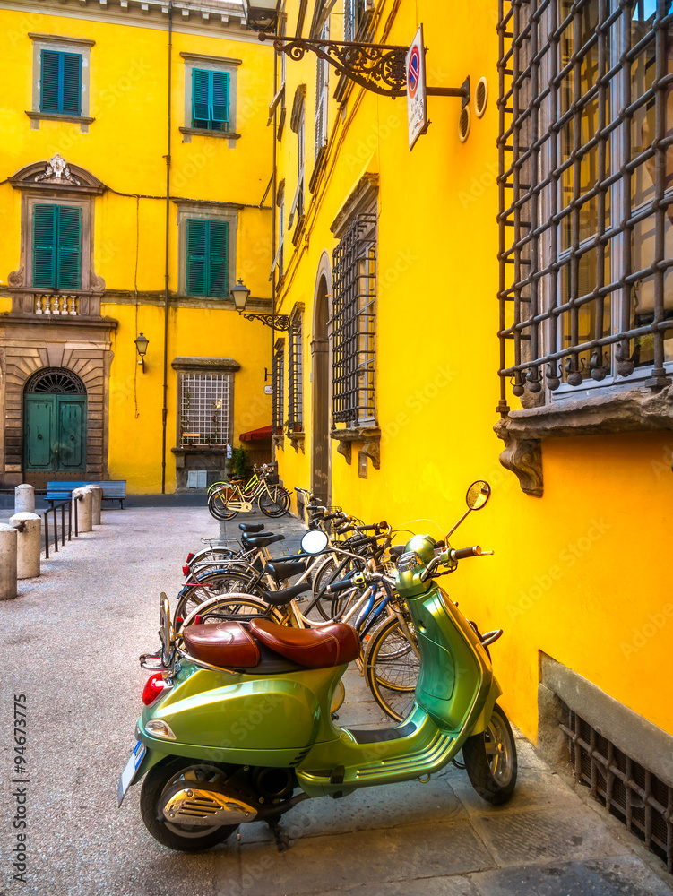 Naklejka premium European motorbikes scooters vespas parked in Lucca Italy