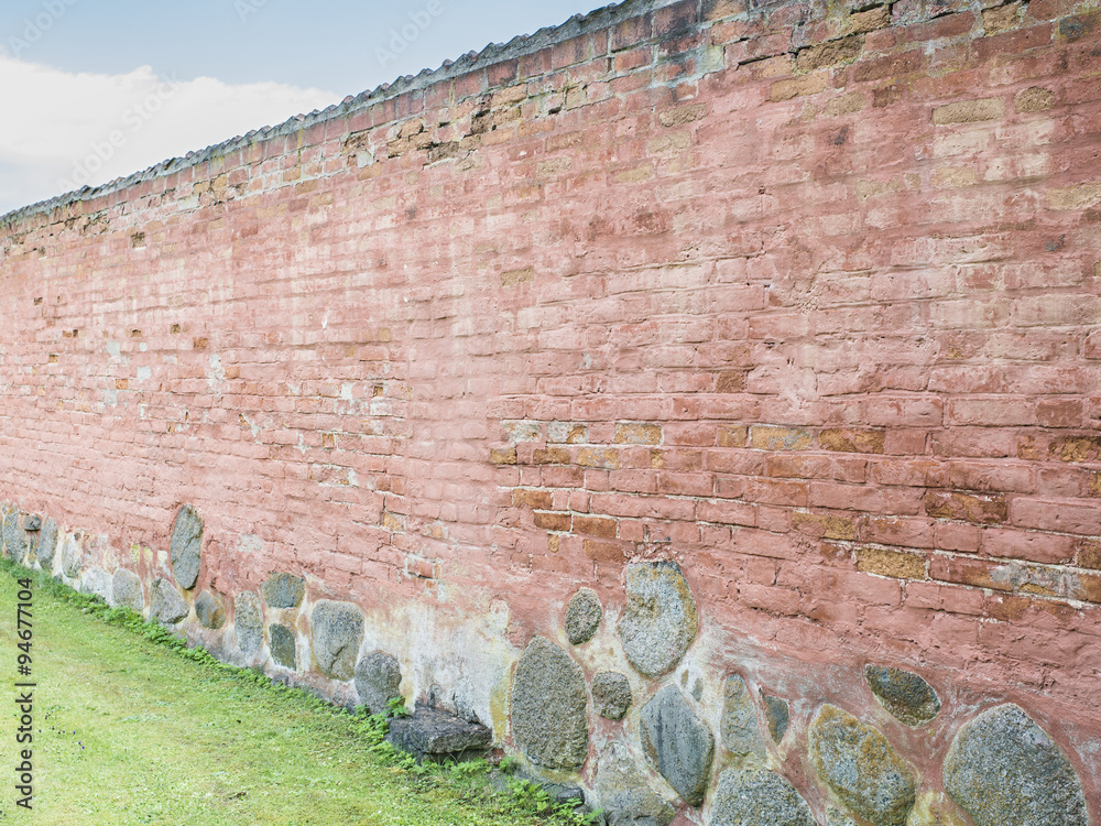 Red brick wall in garden Stock Photo Adobe Stock