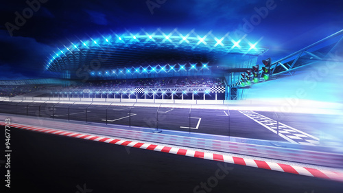 finish line gate on racetrack with stadium in motion blur