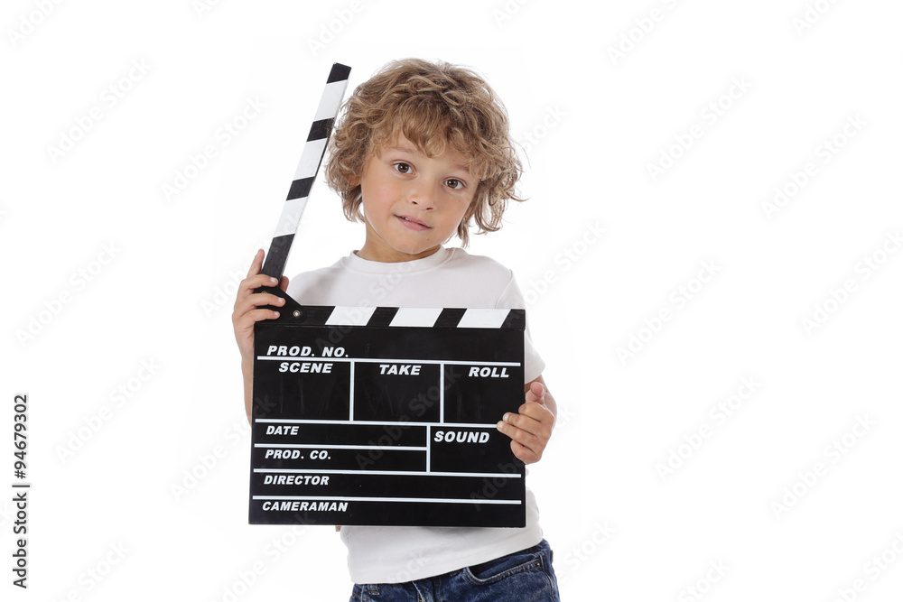Fototapeta premium enfant garçon 6 ans tenant clap de cinéma