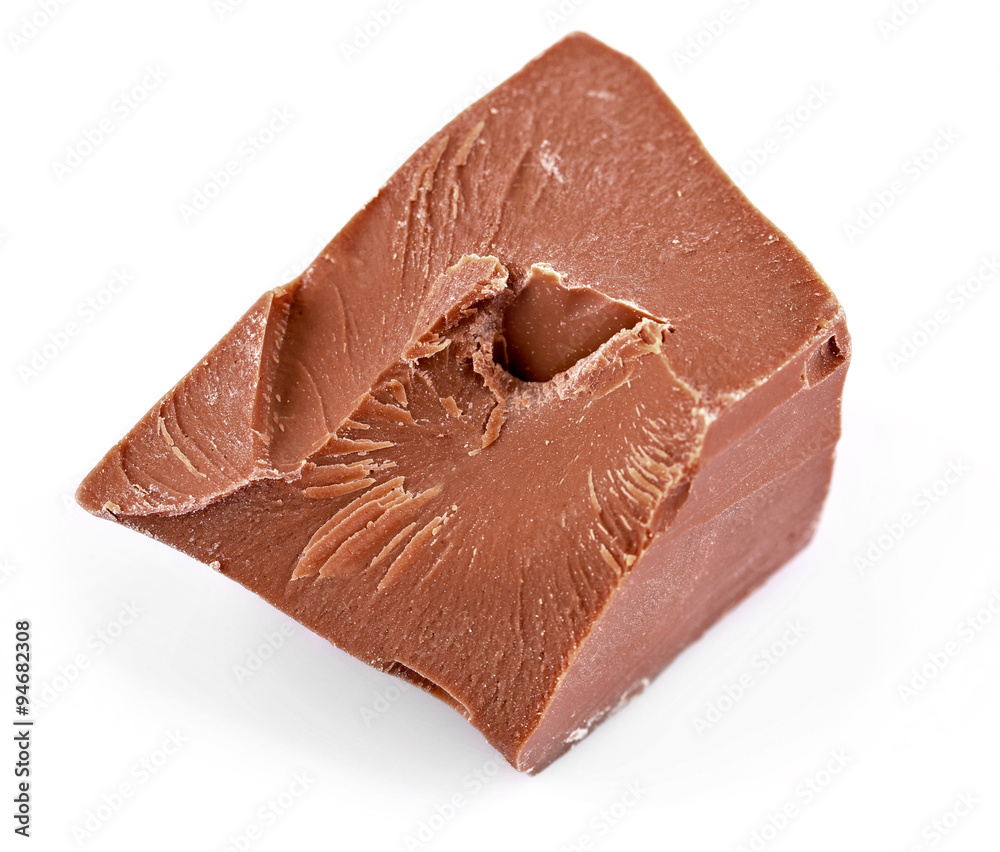 Milk chocolate piece isolated on white Milk chocolate piece isolated on white