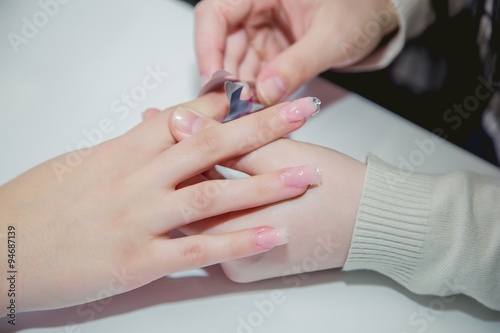 Paint your nails in a beauty salon body care