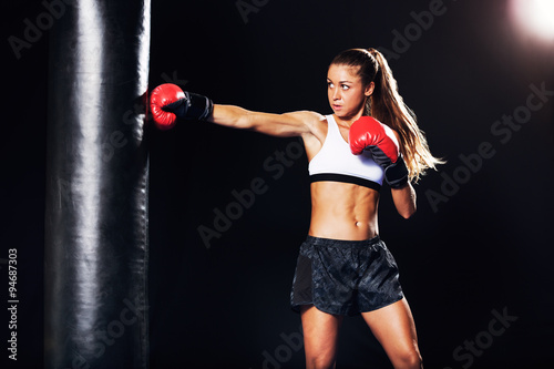 Beautiful Woman Boxing with Red Gloves © EpicStockMedia