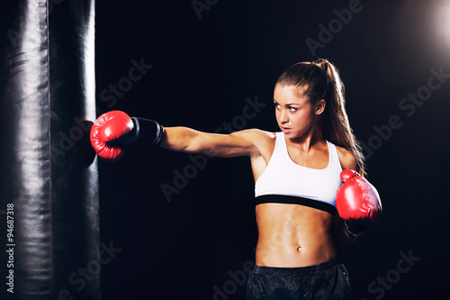 Beautiful Woman Boxing with Red Gloves