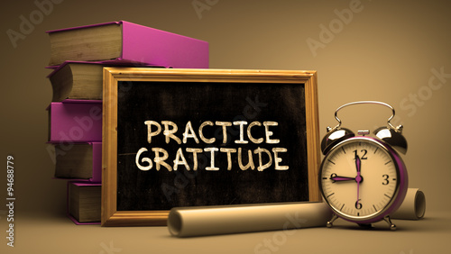 Фотография Practice Gratitude Handwritten on a Blackboard.