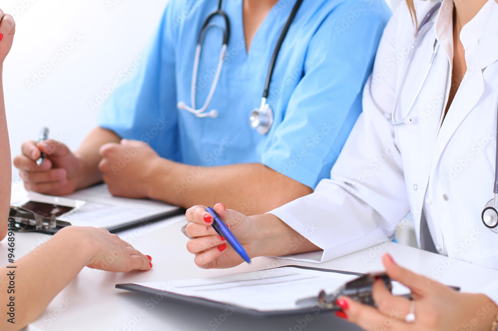 Doctor and patient are discussing something Doctor and patient are discussing something