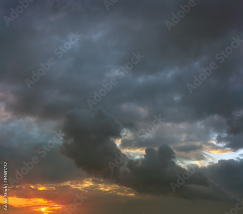 sunset in stormy gray clouds