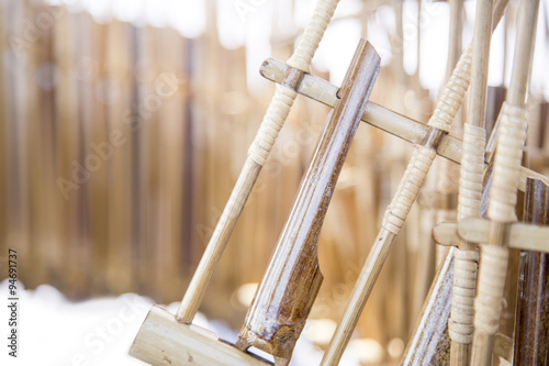The angklung is a musical instrument made of two to four bamboo tubes attached to a bamboo frame.  photo