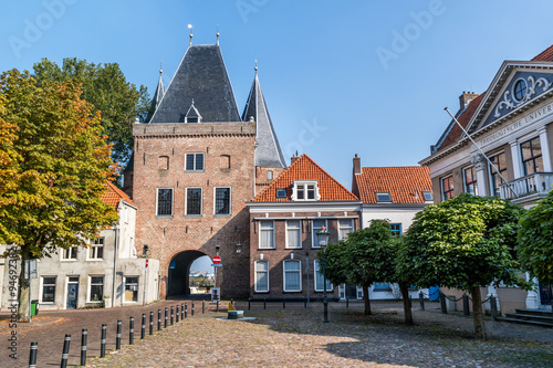 Koornmarkt square and gate in the old city centre of Kampen, Overijssel, Netherlands