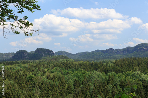 Panorama with rocks  mountains and forest seen from Kuhstall in Saxon Switzerland