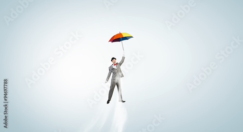 Man fly on umbrella