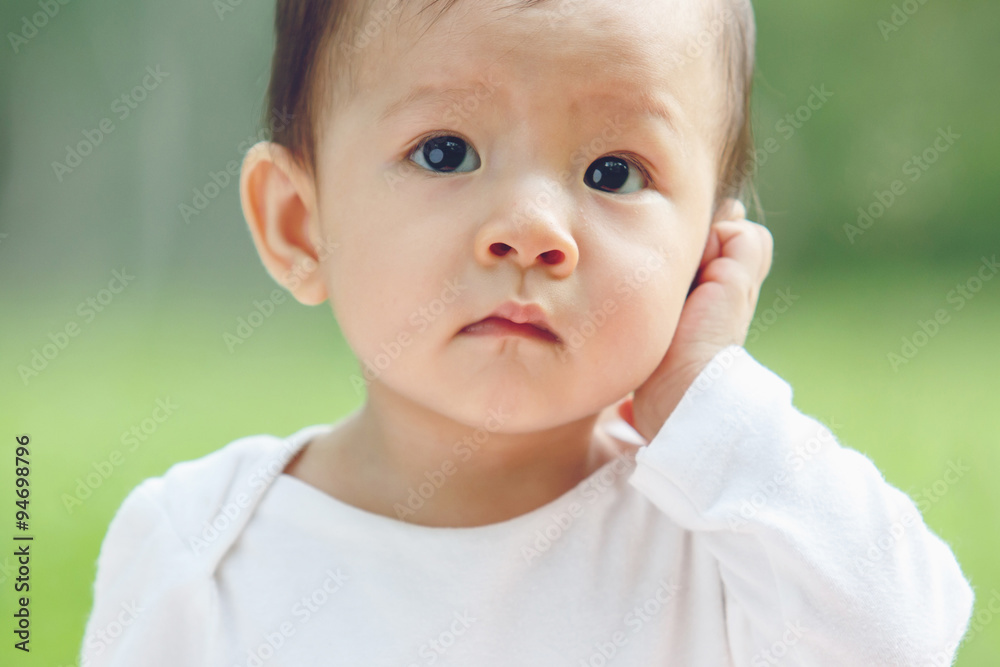 Portrait of an adorable baby girl (soft focus on the eyes)