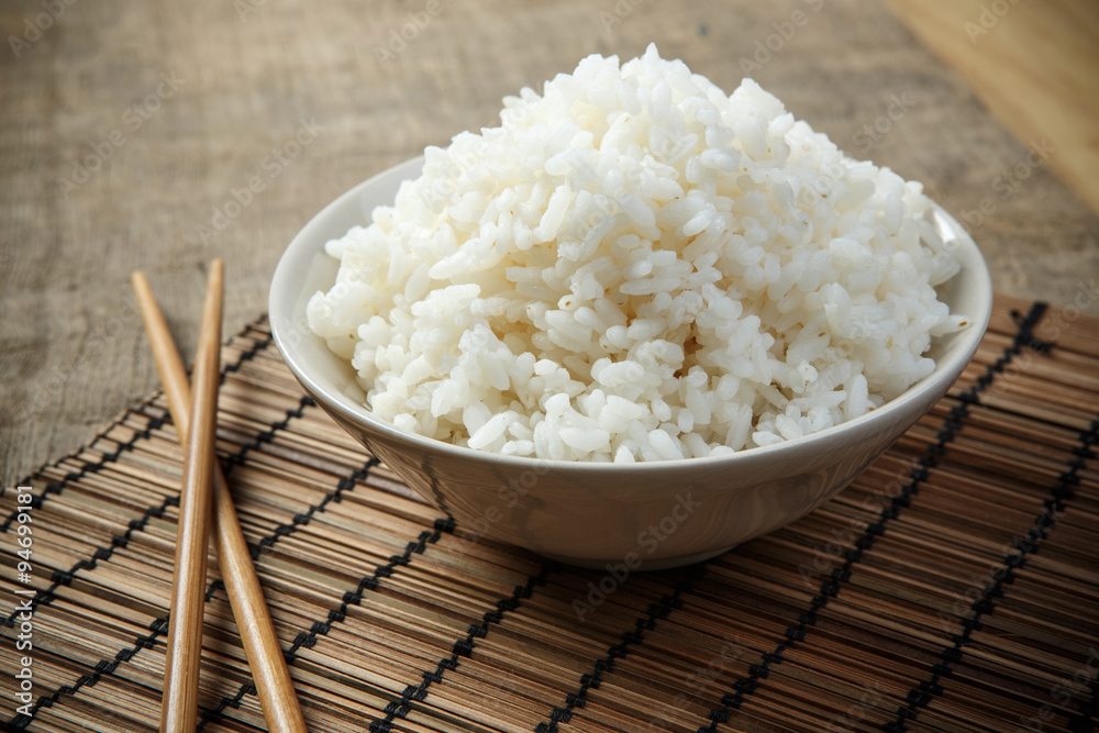 Japan rice with chopsticks on a bamboo mat Japan rice with chopsticks on a bamboo mat
