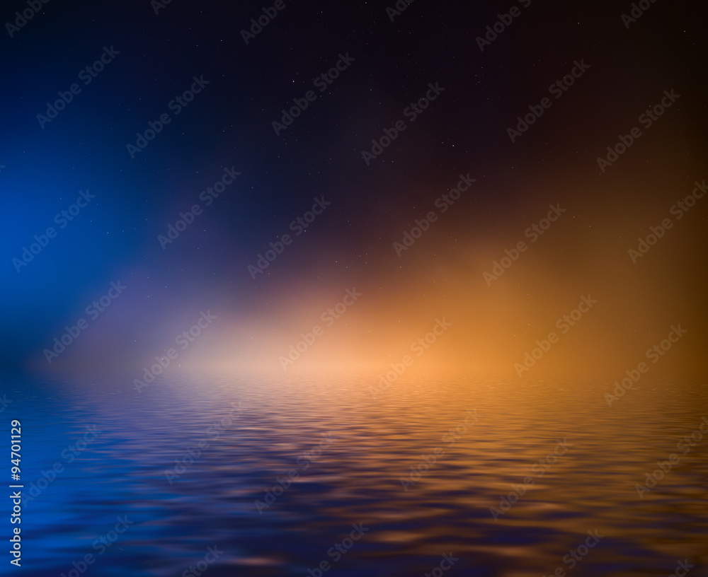 Night sky with colorful cloud and stars reflected in water. Night sky with colorful cloud and stars reflected in water.