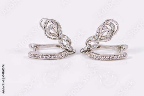 silver earrings in the shape of horseshoe
