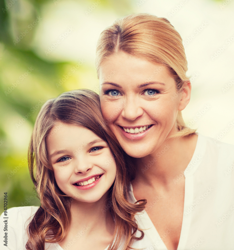 smiling mother and little girl smiling mother and little girl