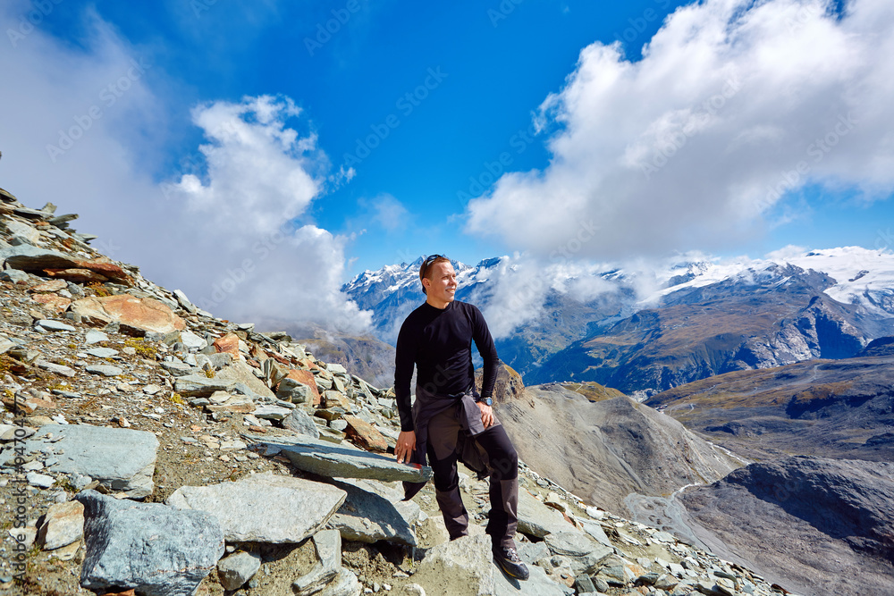 hiker at the top of a pass