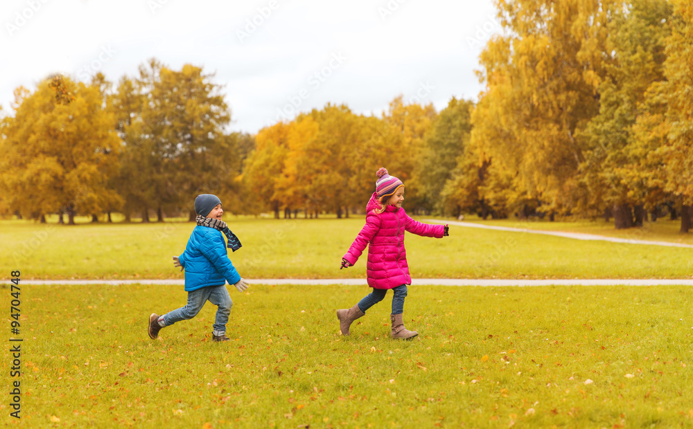 group of happy little kids running outdoors group of happy little kids running outdoors