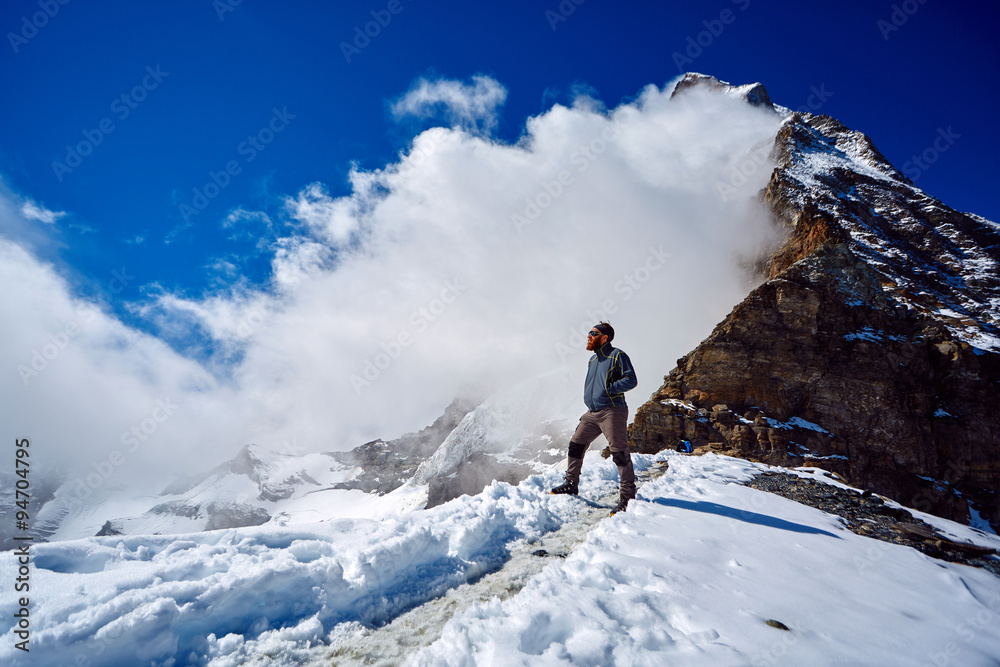 hiker at the top of a pass