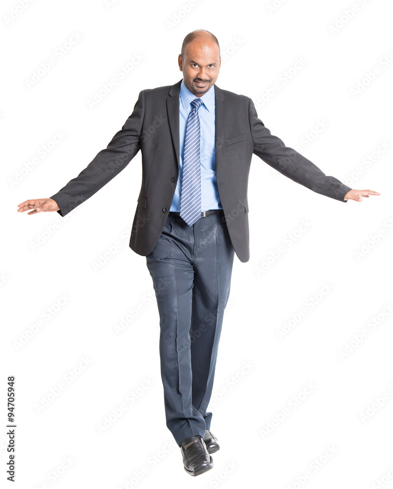 Indian businessman walking balance Indian businessman walking balance