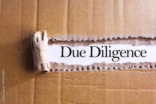 Torn paper box with word Due diligence