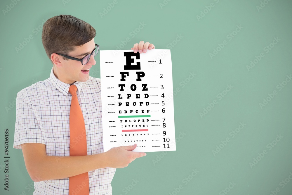 Composite image of geeky hipster smiling and showing card Composite image of geeky hipster smiling and showing card
