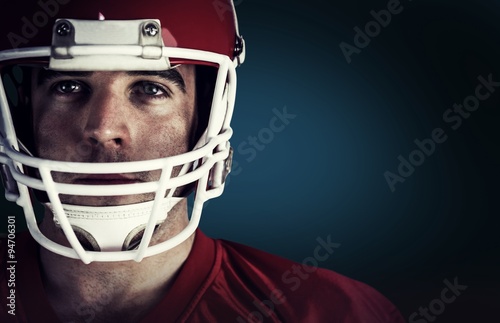 Composite image of american football player looking at camera