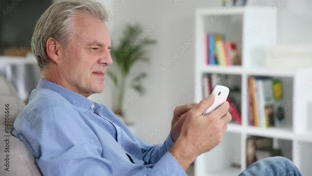 Mature man using a mobil phone 