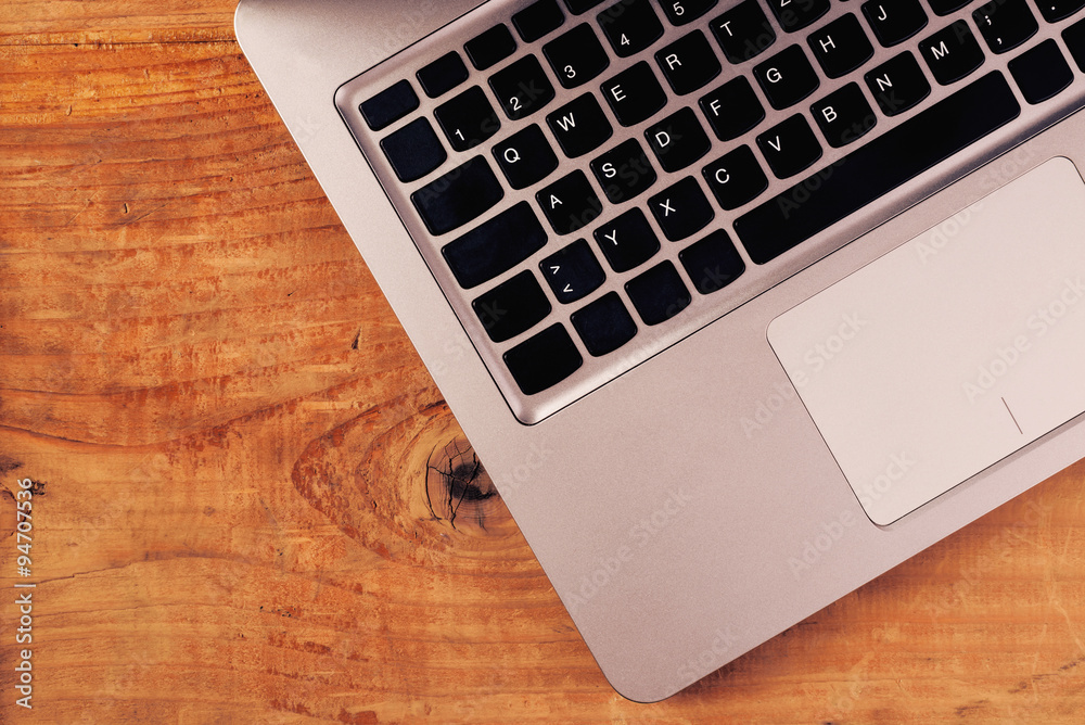 Laptop computer on rustic wooden office desk Laptop computer on rustic wooden office desk