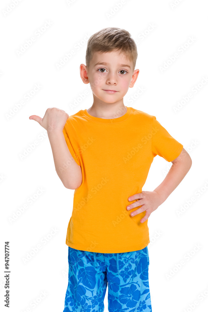 Little boy shows his finger to the side