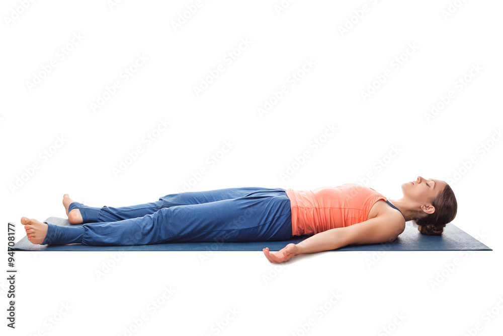 Sporty fit yogi girl relax in yoga asana Savasana Sporty fit yogi girl relax in yoga asana Savasana