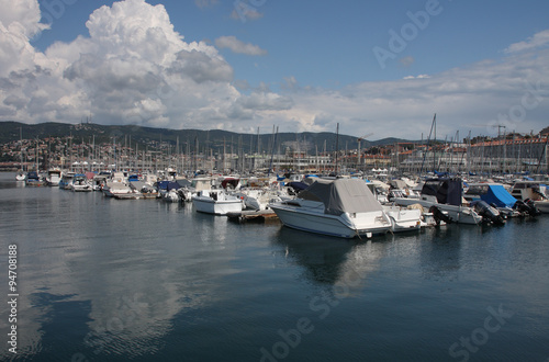 Motor boats and sailboats in harbor in Trieste, Italy