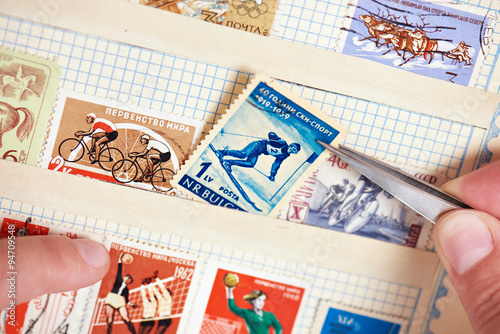 Postage stamp with skier on album